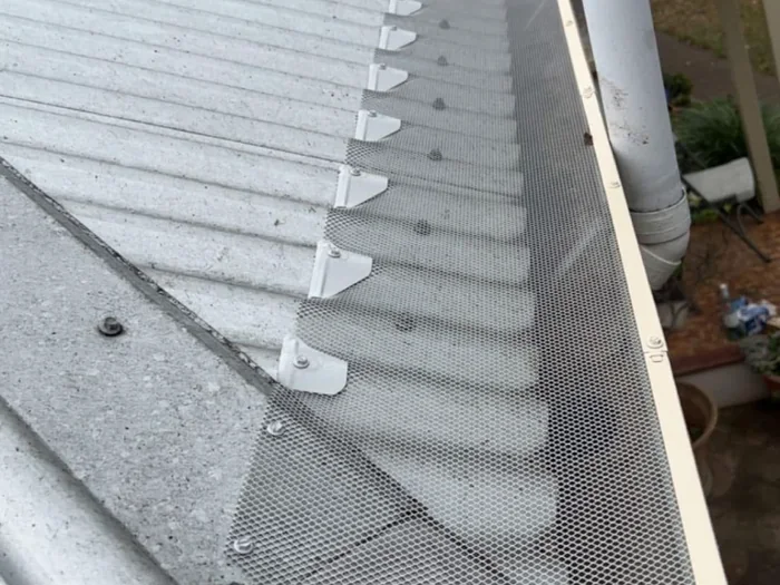 Close-up of installed gutter guard mesh