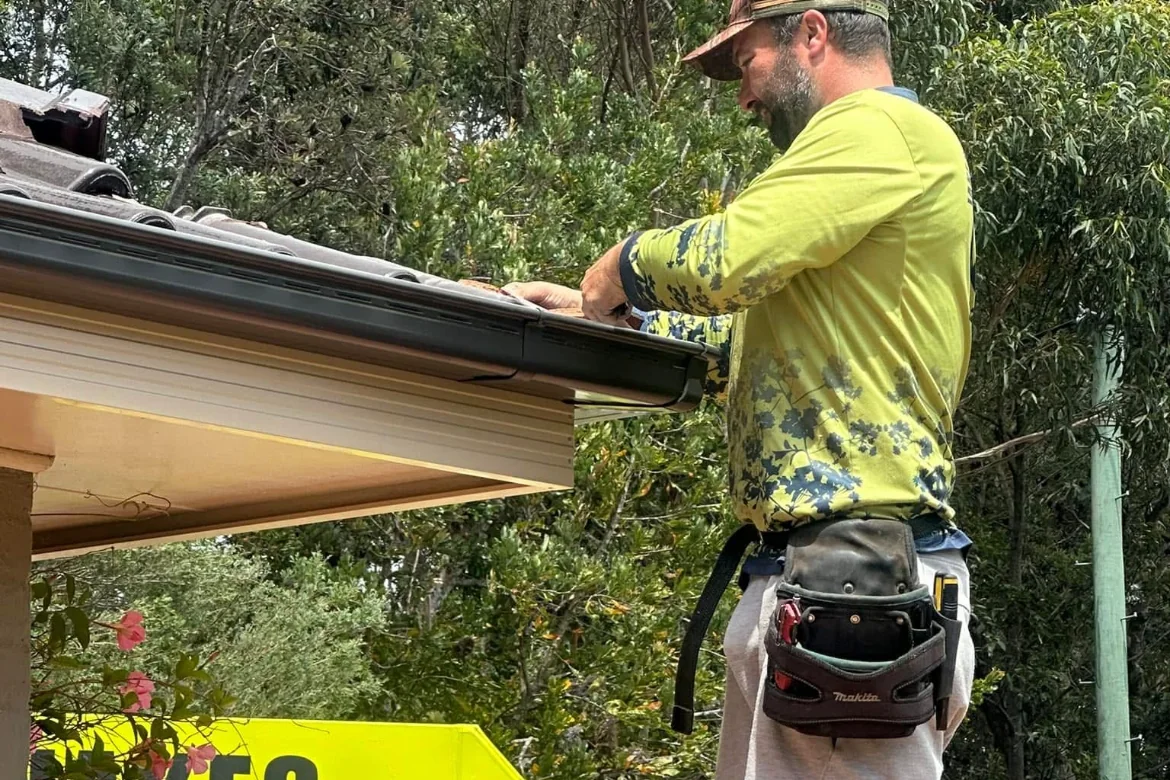 Jake installing gutter guard on a home
